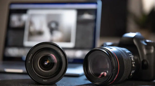 Digital camera lenses displayed for resale evaluation at PayMore Roswell