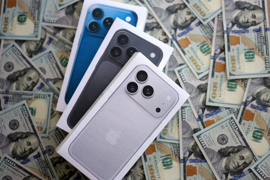 Assorted iPhone 11 and newer models displayed for resale at PayMore Roswell